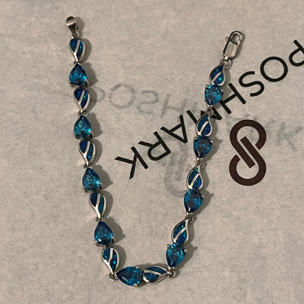 LOVED AUTHENTIC LONDON BLUE TOPAZ STONES/BLUE FIRE OPAL STERLING SILVER BRACELET